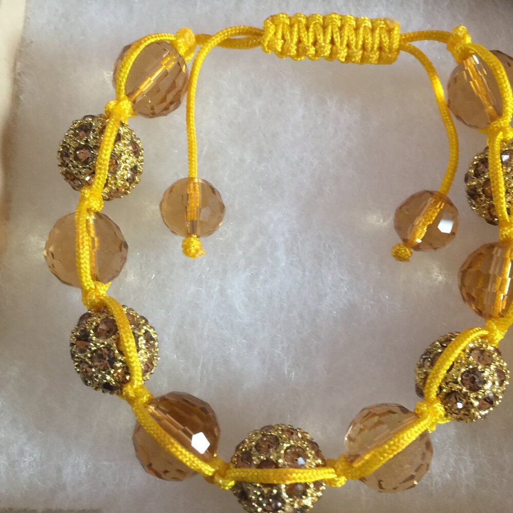 Handmade and crafted Yellow Beaded Shamballa Bracelet with yellow cord.